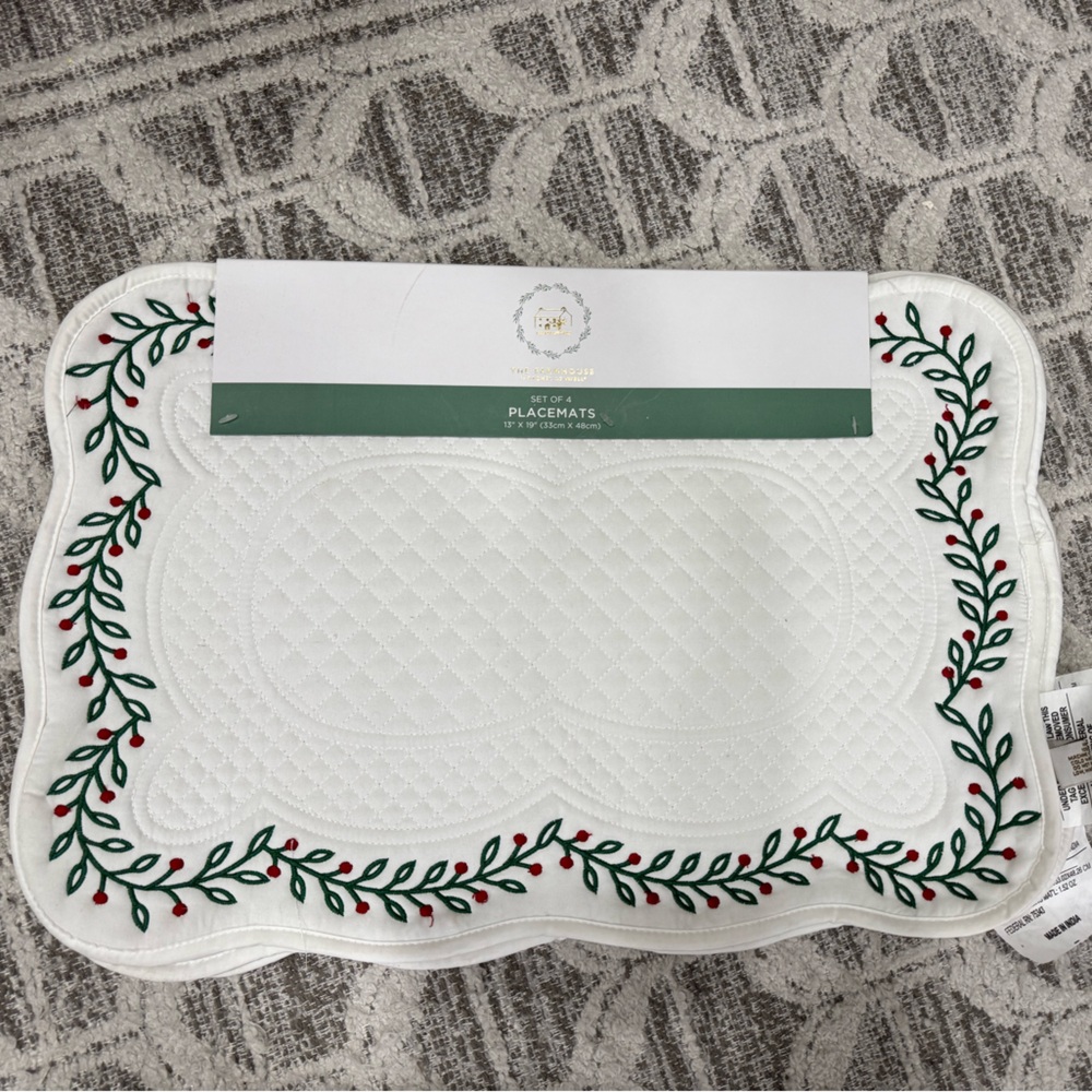 White Quilted Placemat with Red and Green Embroidery